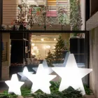 Lámpara de pie en forma de estrella blanca o roja, diseño moderno - Ringostar viadurini