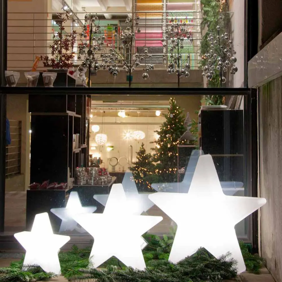 Lámpara de pie en forma de estrella blanca o roja, diseño moderno - Ringostar viadurini