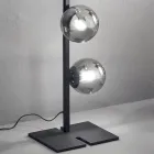 Lámpara de pie moderna en metal negro o dorado y vidrio soplado - Birga viadurini