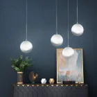 Lámpara de araña lineal Isotta de cuatro luces en cristal blanco, fabricada en Italia. viadurini
