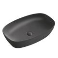 Lavabo rectangular de encimera Aster en cerámica negra mate y blanca.