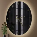 Reloj de pared de cristal con efecto mármol negro y dorado y manecillas de latón - Cortex viadurini