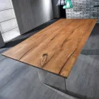 mesa de madera dura sólida con las piernas en vidrio templado Tito viadurini