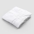 Mantel de lino blanco con cenefa de motivo plisado de lujo italiano - Tippel
