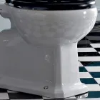WC montado en el piso con casete de cerámica y asiento negro Made in Italy - Marwa viadurini