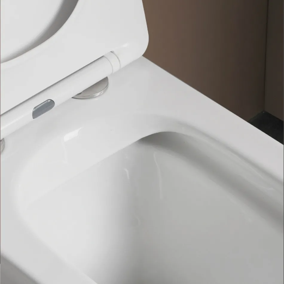 Inodoro de pie con asiento cerámico de cierre suave y diseño moderno - Giunco viadurini