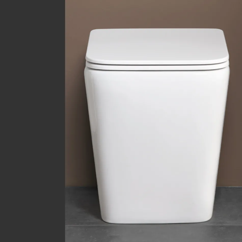 Inodoro de pie con asiento cerámico de cierre suave y diseño moderno - Giunco viadurini