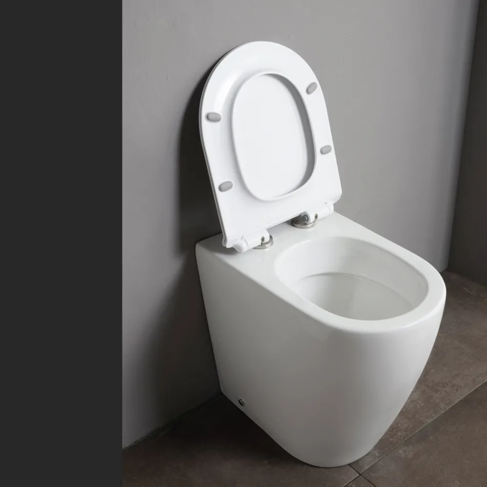Inodoro de cerámica Oleander con descarga deslizante y asiento de cierre suave. viadurini