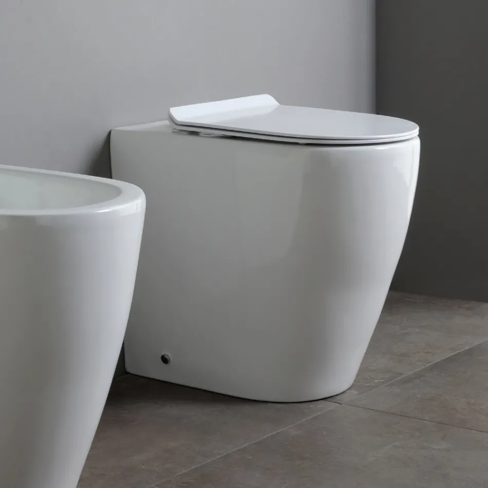 Inodoro de cerámica Oleander con descarga deslizante y asiento de cierre suave. viadurini