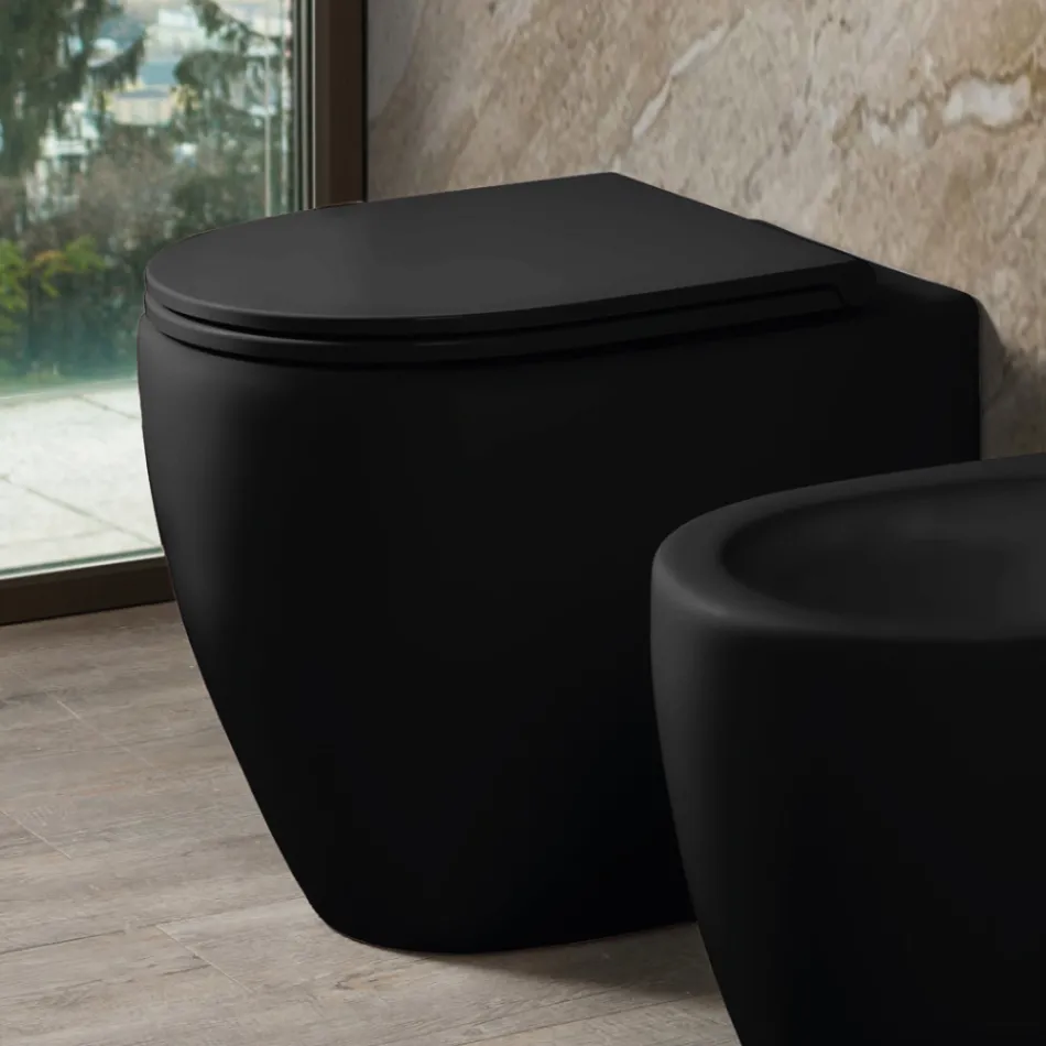 Inodoro Aster de cerámica mate bicolor sin borde con asiento de cierre suave.   viadurini