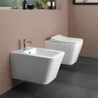 Inodoro suspendido con asiento cerámico de cierre suave y diseño moderno - Giunco viadurini